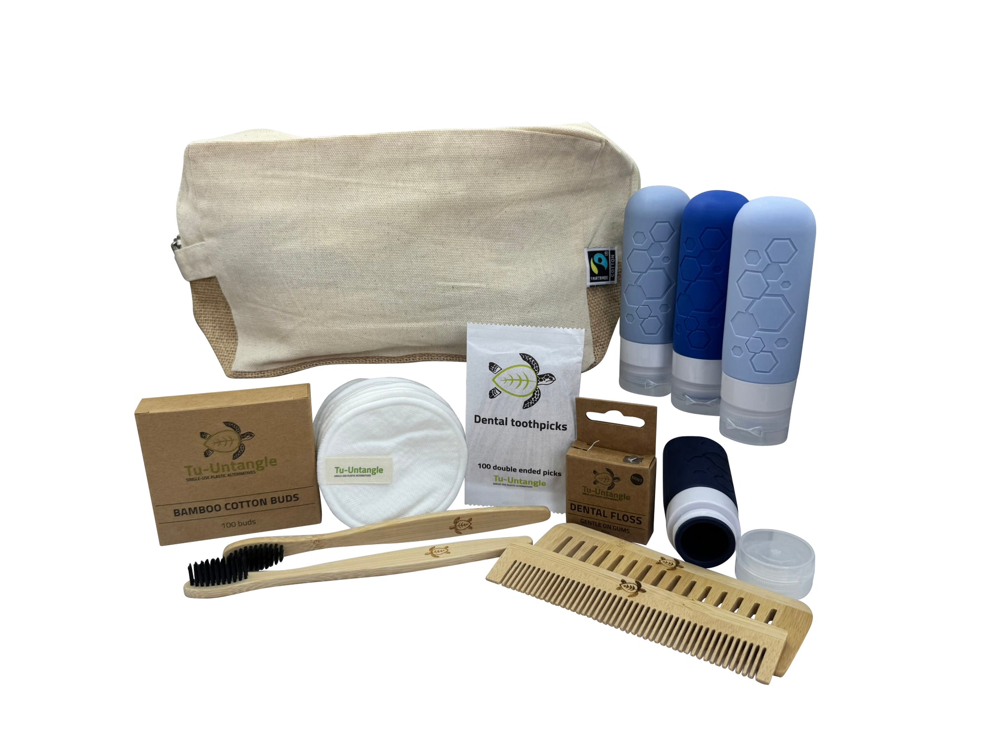 Collection of eco-friendly products including a canvas bag, bamboo toothbrush, and cleaning items on a white background.