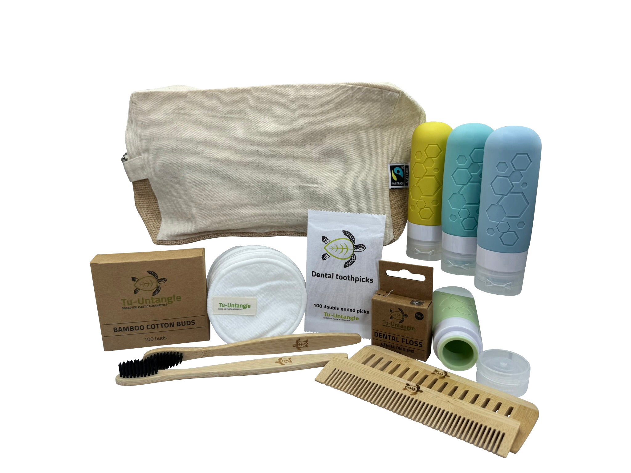 Collection of zero-waste products including a bag, toothbrush, comb, and containers on a white background.